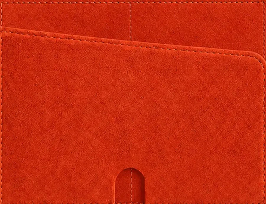 Close-up of PETTY CASH microsuede in orange